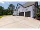 New construction home with attached two car garage and large driveway on spacious lot at 8621 Bishop Pine Ln, Wake Forest, NC 27587