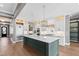 Spacious kitchen featuring a large center island, marble countertops, and custom cabinetry at 8621 Bishop Pine Ln, Wake Forest, NC 27587