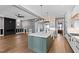 This bright kitchen boasts a large island perfect for entertaining and ample counter space at 8621 Bishop Pine Ln, Wake Forest, NC 27587