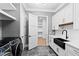 Laundry room features stainless steel appliances and plenty of storage space at 8621 Bishop Pine Ln, Wake Forest, NC 27587