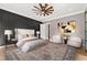 Comfortable main bedroom featuring stylish decor, a ceiling fan and an ornate area rug at 8621 Bishop Pine Ln, Wake Forest, NC 27587