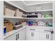 Walk-in pantry offers generous storage space with custom shelving and cabinets at 8621 Bishop Pine Ln, Wake Forest, NC 27587
