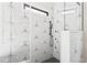 Modern shower with glass surround and contrasting black fixtures at 8621 Bishop Pine Ln, Wake Forest, NC 27587
