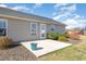 Backyard featuring a patio, landscaped areas, and a well-maintained lawn perfect for outdoor enjoyment at 107 Rollingwood Cir, Kenly, NC 27542