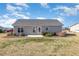 Backyard featuring a patio, landscaped areas, and a lawn offering a serene outdoor space at 107 Rollingwood Cir, Kenly, NC 27542