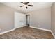 Bedroom boasting hardwood floors, a closet, and an ensuite bathroom offering practicality and style at 107 Rollingwood Cir, Kenly, NC 27542