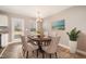 A dining room with hardwood floors, a decorative chandelier, and an attractive table setting at 107 Rollingwood Cir, Kenly, NC 27542