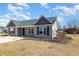 Single-story house features a well-kept lawn, tidy landscaping, and a solid concrete driveway at 107 Rollingwood Cir, Kenly, NC 27542