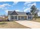 Inviting single-story house with manicured lawn, a concrete driveway, and a classic design at 107 Rollingwood Cir, Kenly, NC 27542