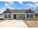 Charming single-story home featuring a well-maintained front yard and inviting entrance at 107 Rollingwood Cir, Kenly, NC 27542