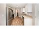 Open kitchen featuring stainless steel appliances, granite countertops, and white cabinets at 107 Rollingwood Cir, Kenly, NC 27542