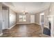 Inviting living room featuring modern wood flooring, neutral paint, and a cozy fireplace at 107 Rollingwood Cir, Kenly, NC 27542