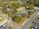 Aerial view of the property surrounded by mature trees and a parking lot at 110 W Elm St, Nashville, NC 27856