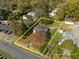 Aerial view of the property with yellow property line estimate surrounded by trees at 110 W Elm St, Nashville, NC 27856