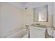 Bathroom with a tub, sink, medicine cabinet, and toilet; in need of repairs at 110 W Elm St, Nashville, NC 27856