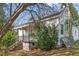 Exterior view of the home featuring a side porch and mature landscaping at 110 W Elm St, Nashville, NC 27856