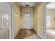 Hallway with a white front door that leads to the outside of the home at 110 W Elm St, Nashville, NC 27856