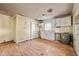 Kitchen featuring cabinets, sink, window, and hot water heater at 110 W Elm St, Nashville, NC 27856