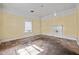 Living room with natural light from window and charming white fireplace at 110 W Elm St, Nashville, NC 27856