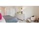 Bedroom featuring a dresser with elegant decor and a chair beside the bed at 129 Ethel Ln, Angier, NC 27501