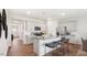 Stylish kitchen with an island, stainless steel appliances, and open access to other living spaces at 129 Ethel Ln, Angier, NC 27501