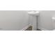 Powder room featuring pedestal sink, white walls and trim with modern flooring at 139 Ethel Ln, Angier, NC 27501