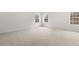 Bright bedroom with neutral carpet and trim featuring three large windows at 139 Ethel Ln, Angier, NC 27501