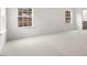 Spacious bedroom with neutral carpet, white trim and walls and natural lighting at 139 Ethel Ln, Angier, NC 27501