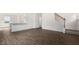 Spacious living room with hardwood flooring, open layout with a view of the stairs at 139 Ethel Ln, Angier, NC 27501