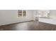 Open-concept living room featuring hardwood flooring and a view into the kitchen at 139 Ethel Ln, Angier, NC 27501