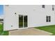 Concrete patio featuring a sliding glass door and white siding at 139 Ethel Ln, Angier, NC 27501