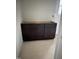 A dark wood bathroom vanity with drawers sits ready for plumbing and countertop installation at 1516 Bragg St, Sanford, NC 27330