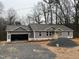 New construction home with attached two-car garage and gray siding at 1516 Bragg St, Sanford, NC 27330