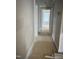 Bright hallway with paneled wainscotting, leading to other rooms, bathed in natural light at 1516 Bragg St, Sanford, NC 27330