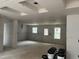 Spacious living room featuring multiple windows for natural light and backyard view at 1516 Bragg St, Sanford, NC 27330