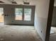 Bright living room with large windows offering an inviting atmosphere at 1516 Bragg St, Sanford, NC 27330