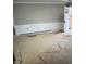 Bright living room featuring detailed wall paneling and a light-filled entrance at 1516 Bragg St, Sanford, NC 27330
