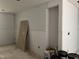 Storage room with drywall in progress and rough opening to an adjacent area at 1516 Bragg St, Sanford, NC 27330