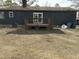 This backyard features a brown wooden deck and space for gardening or other outdoor activities at 1729 Augustus Dr, Rocky Mount, NC 27801
