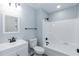 A bathroom featuring a modern vanity with a black faucet and a black towel bar at 1729 Augustus Dr, Rocky Mount, NC 27801