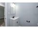 A bathroom featuring a modern vanity with a black faucet and light fixture at 1729 Augustus Dr, Rocky Mount, NC 27801