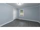 A bedroom featuring wood-look flooring, a window and a closet at 1729 Augustus Dr, Rocky Mount, NC 27801
