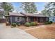 Inviting home exterior showcasing a well-manicured lawn, walkway and a covered front porch at 1729 Augustus Dr, Rocky Mount, NC 27801