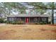 Charming single-story home featuring a welcoming front porch and a vibrant red front door at 1729 Augustus Dr, Rocky Mount, NC 27801