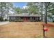 Charming single-story home with a cozy front porch and lovely landscaping at 1729 Augustus Dr, Rocky Mount, NC 27801