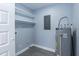 Laundry room with gray flooring, white shelves, and gray water heater with white trim at 1729 Augustus Dr, Rocky Mount, NC 27801