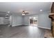 Open living room with hardwood floors, fireplace, and a sliding glass door to the deck at 1729 Augustus Dr, Rocky Mount, NC 27801
