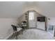 Attic space featuring a table and chairs and access to outside at 2010 Twin Acres Rd, Clayton, NC 27520
