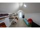 A functional attic space featuring carpet and shelving at 2010 Twin Acres Rd, Clayton, NC 27520