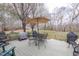Outdoor deck with patio furniture and umbrella, offering a relaxing space for outdoor entertaining and dining at 2010 Twin Acres Rd, Clayton, NC 27520